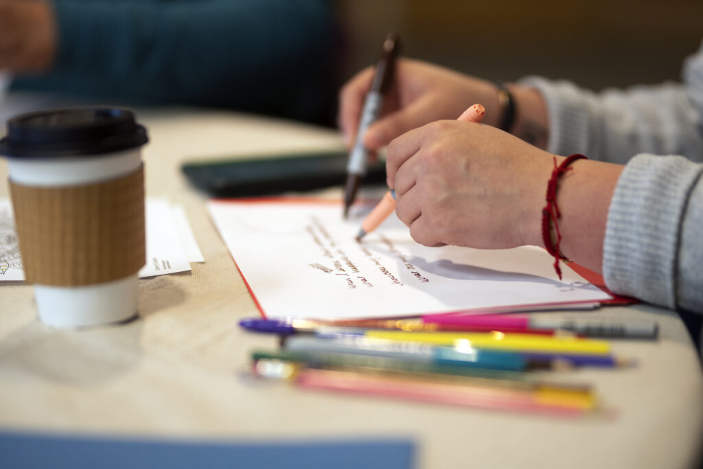 Program participants engage in a creative practice involving bilateral brain engagement at a retreat.