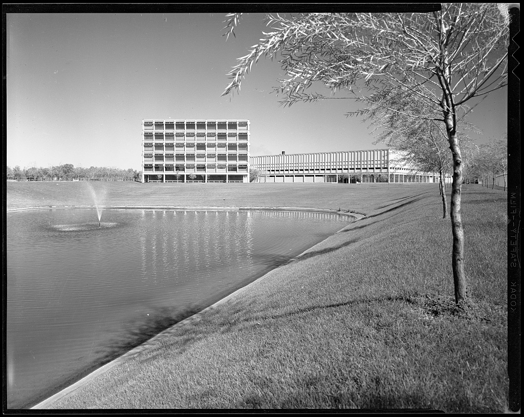 A lake with a building in the background.