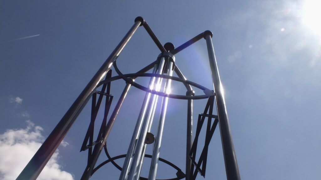 A giant metal wind chime sculpture.